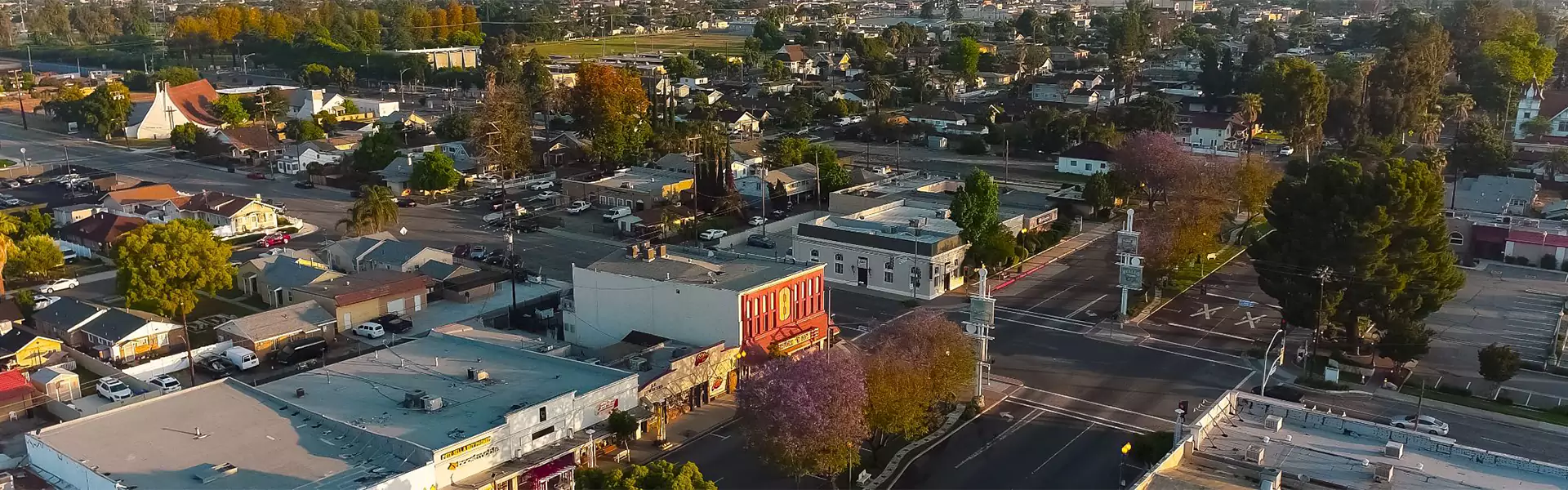 Aerial view of a suburban neighborhood at sunset.