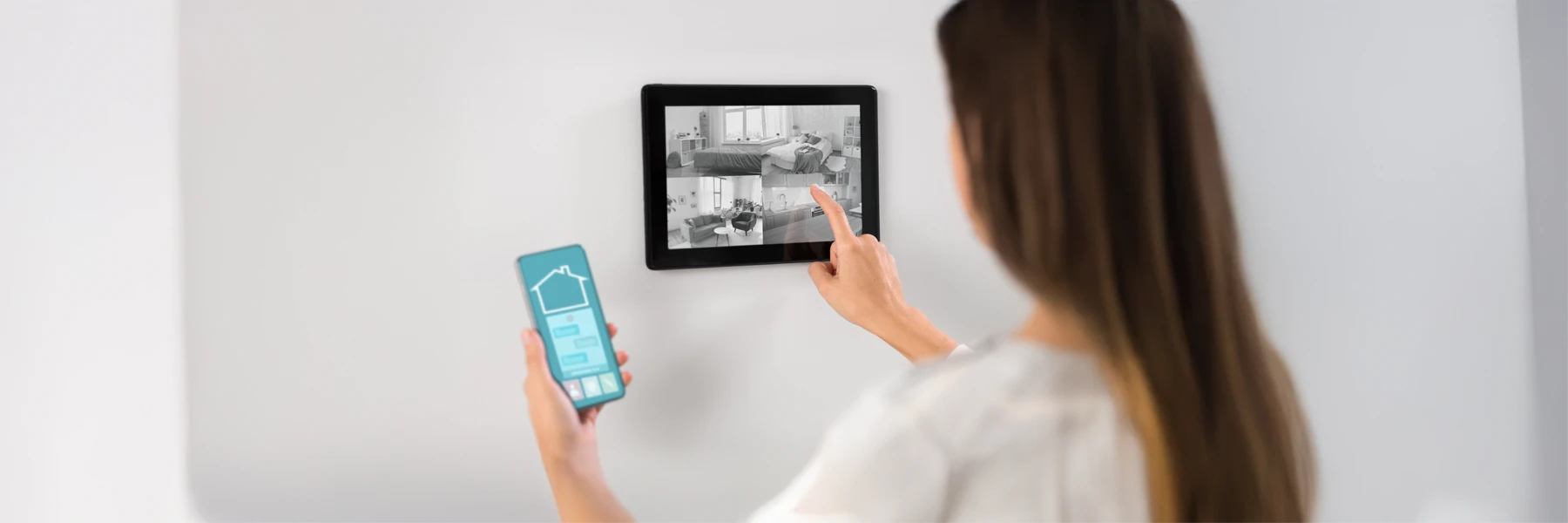 Woman using smart home security system